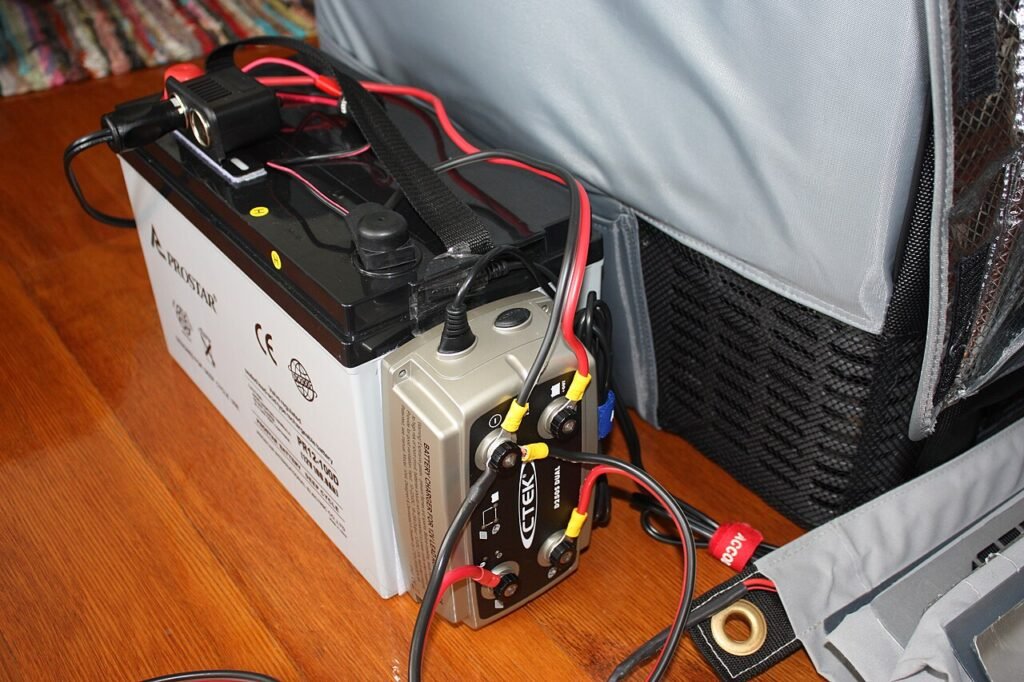 A CTEK battery charger connected to a car battery