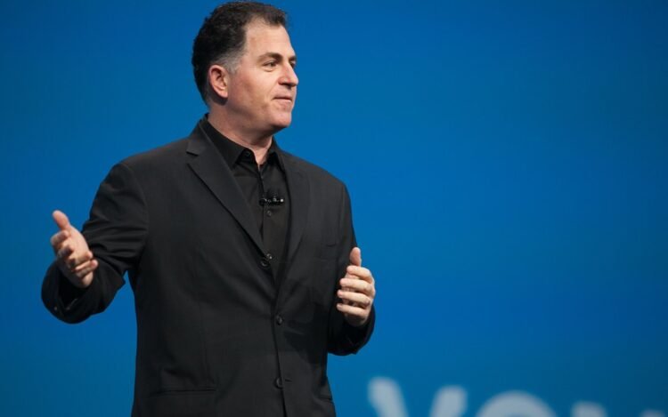 Michael Dell net worth 2026: Dell Technologies founder Michael Dell speaking on stage in 2011