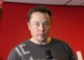Elon Musk speaking at a Tesla event