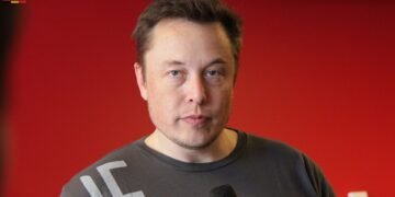 Elon Musk speaking at a Tesla event